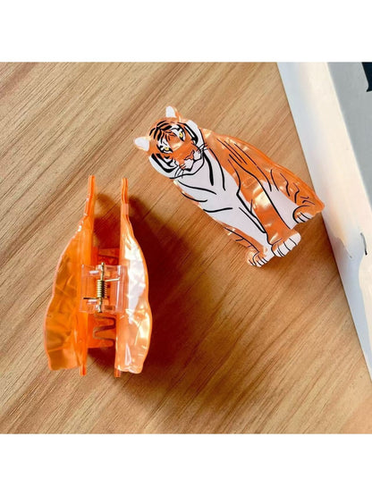 Beau tiger shape hair clip worn in long brown hair