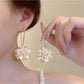 Close-up of Earedge Hydrangea shaped drop earrings with intricate petal design
