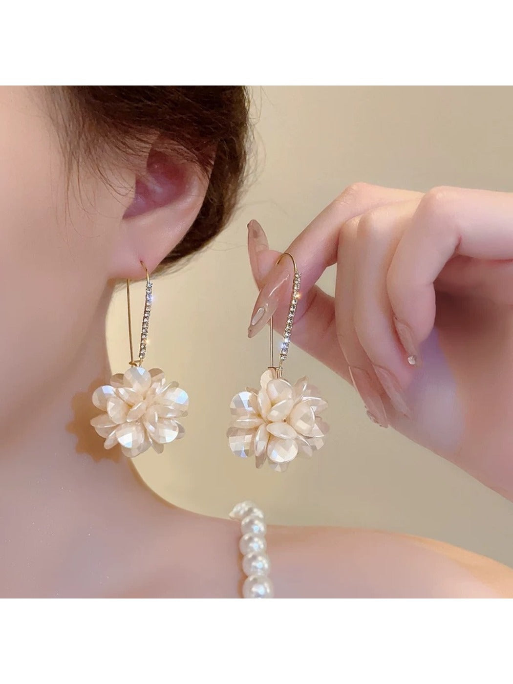 Close-up of Earedge Hydrangea shaped drop earrings with intricate petal design