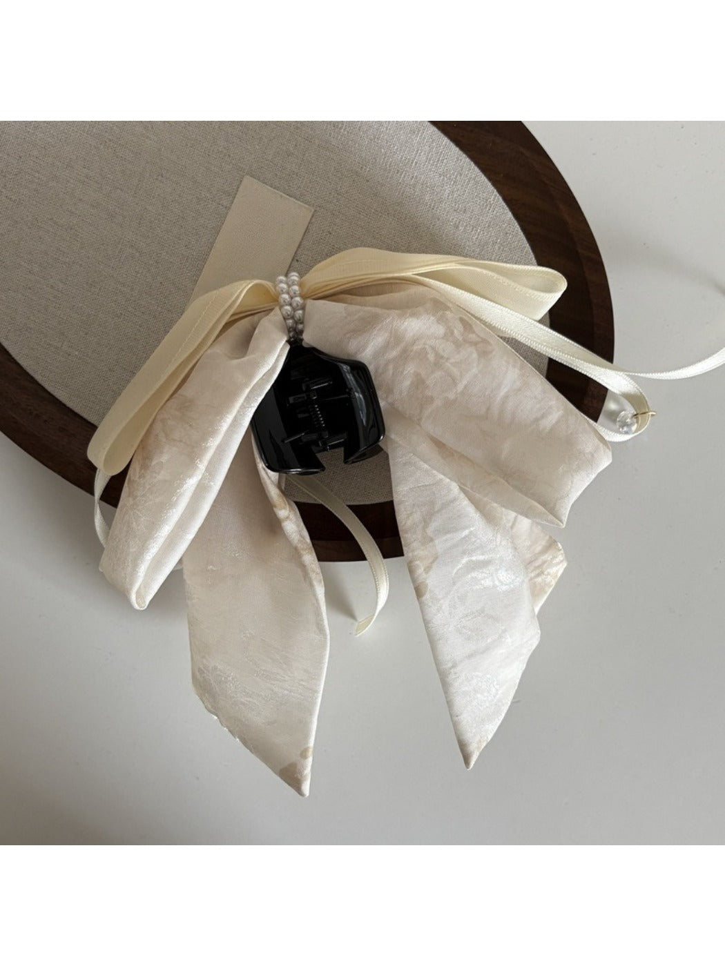 Back view of Beau bow ribbon streamer claw clip securing hair in a half-up style