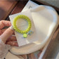 Gifty - Plastic Flower Bead Spiral Hair Tie