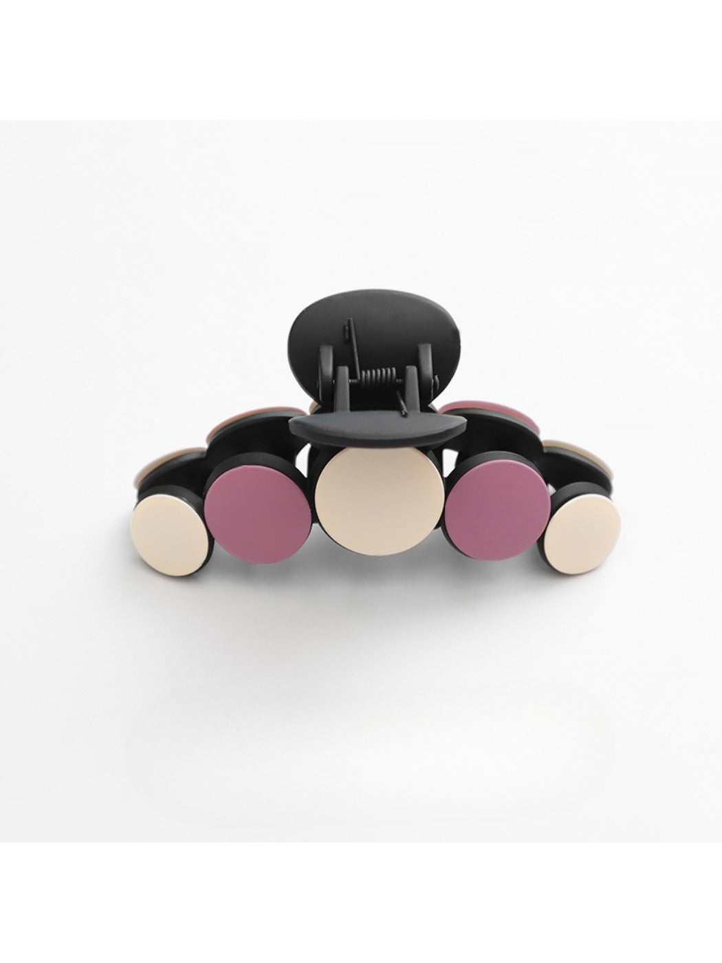 Beau hair clip paired with other hair accessories on a vanity