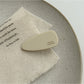 Beau acetate pink tone hair clip angled to show thickness and texture