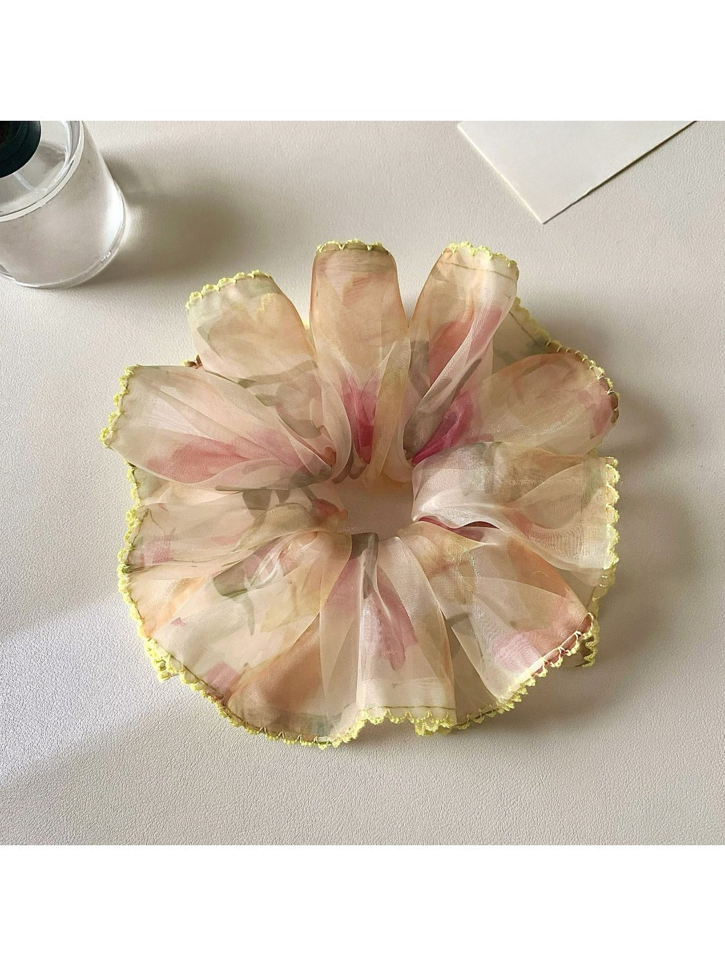 Side view of Gifty retro floral scrunchie highlighting gathered fabric design