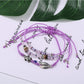 Side view of Lovra alloy charm small bead bracelet displaying bead arrangement and charm