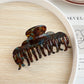 Beau claw clip shown from top angle emphasizing crescent shape