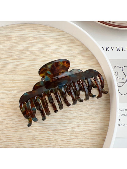 Beau claw clip shown from top angle emphasizing crescent shape
