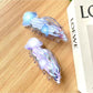 Close-up of Beau jellyfish claw clip showing detailed tentacle design and clasp mechanism