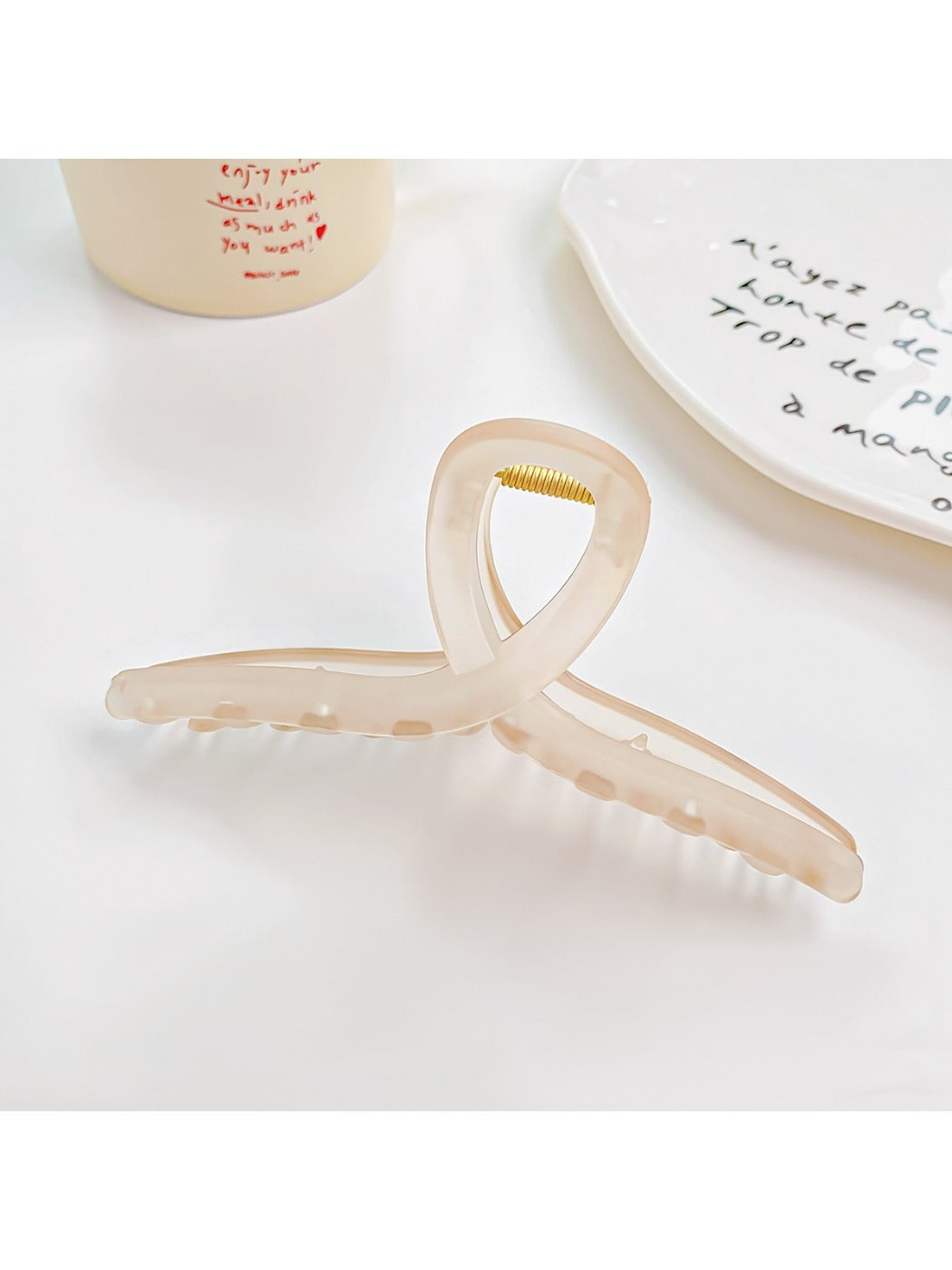 Model wearing Beau square crisscross hair claw clip with loose waves
