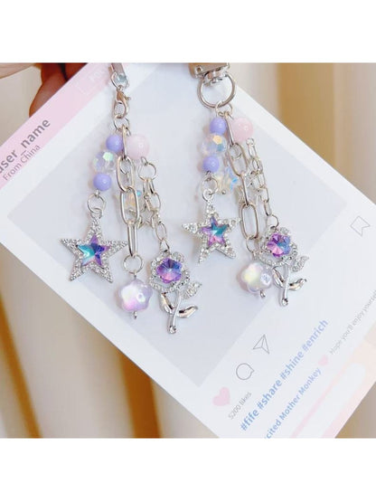 Purple star-shaped flower charm on a silver keyring keychain