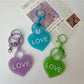 Solid color heart-shaped pendant keychain in blue with silver keyring