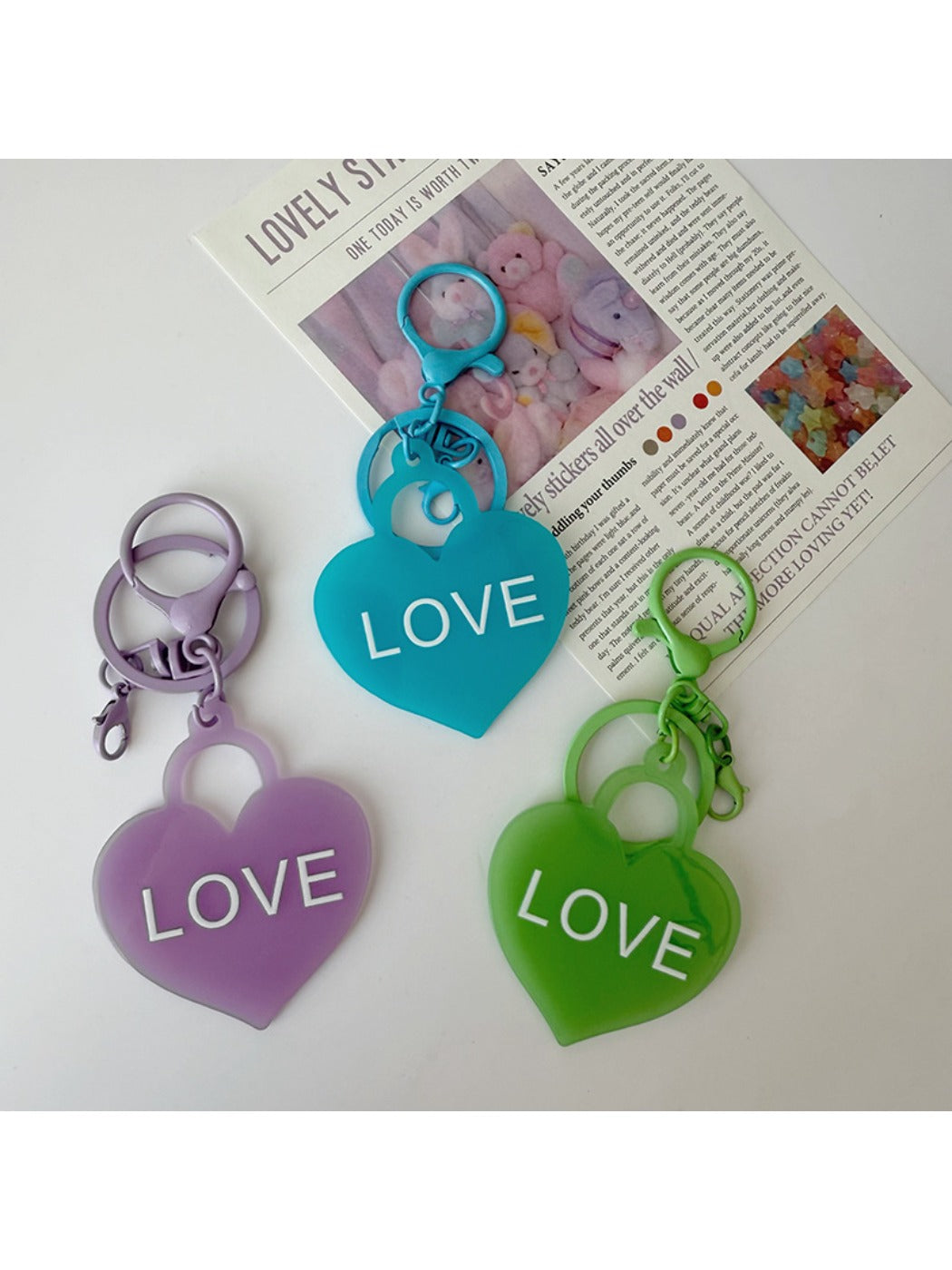 Solid color heart-shaped pendant keychain in blue with silver keyring