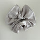 Gifty satin finish silky scrunchie folded neatly on a light-colored surface