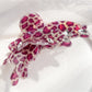 Top view of Beau leopard print butterfly shaped claw clip