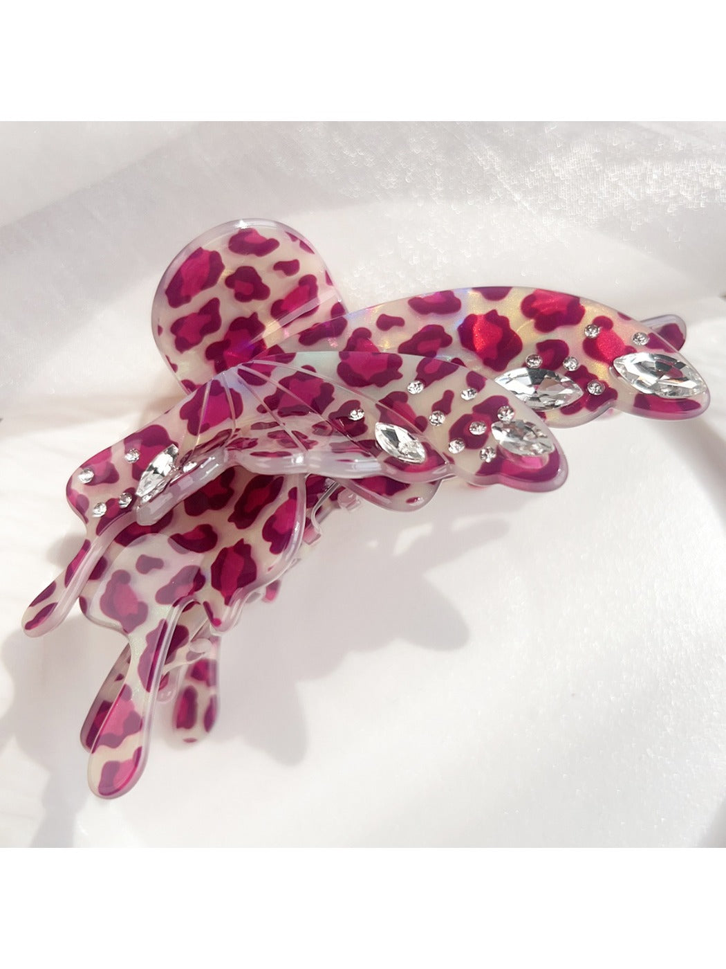 Top view of Beau leopard print butterfly shaped claw clip