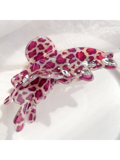 Top view of Beau leopard print butterfly shaped claw clip
