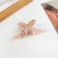 Close-up of bow detail on Beau hair claw clip showing smooth edges