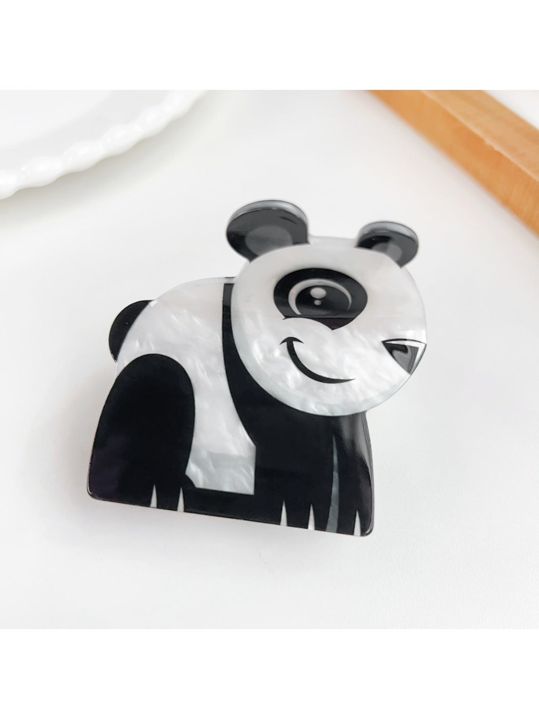 Beau animal hair claw clip with bear design clipped in brown hair