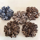 Vintage leopard print scrunchie displayed flat showing ruched fabric detail