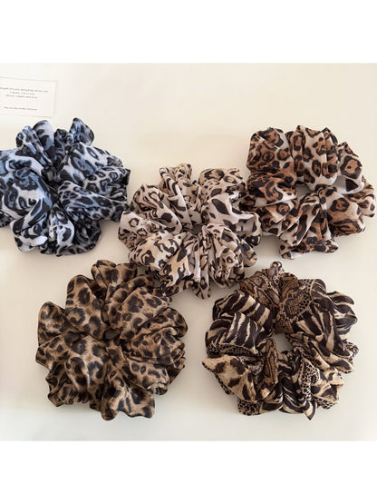 Vintage leopard print scrunchie displayed flat showing ruched fabric detail