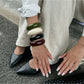Close-up of Lovra open cuff bracelet showing smooth matte texture