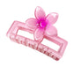 Beau square ombre flower shaped claw clip styled in hair demonstrating hold and size
