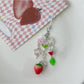 Sweet Tulip Strawberry keychain displayed hanging against a white background