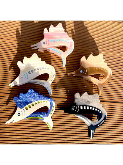 Close-up of Beau sturgeon claw clip showing textured surface and curved claws