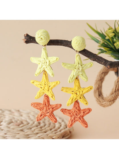 Detailed shot of star pendant and chain on Earedge earrings