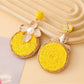 Earedge floral drop earrings displayed on a white background showing circular design