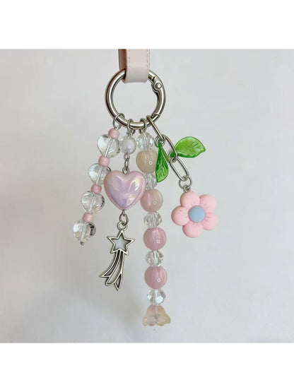 Keypus heart charm keychain showing detailed beadwork and gold keyring