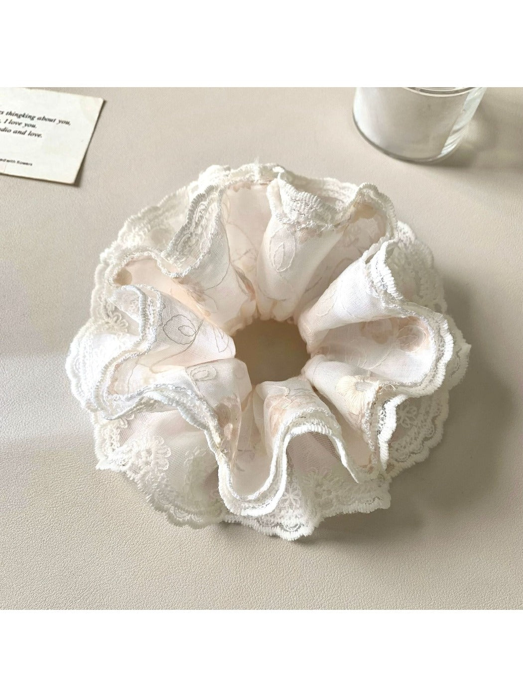 Side view of Gifty minimalist scrunchie showing gathered fabric and elastic inside