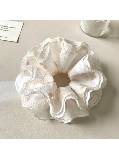 Side view of Gifty minimalist scrunchie showing gathered fabric and elastic inside