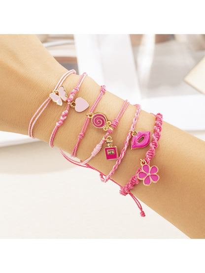 Lovra pink pendant layered bracelet worn on wrist, highlighting layered design and pink pendant