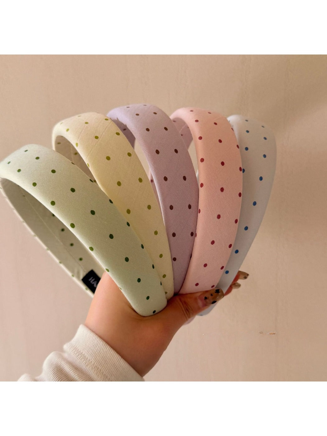 Side view of Gifty polka dot headband highlighting fabric texture