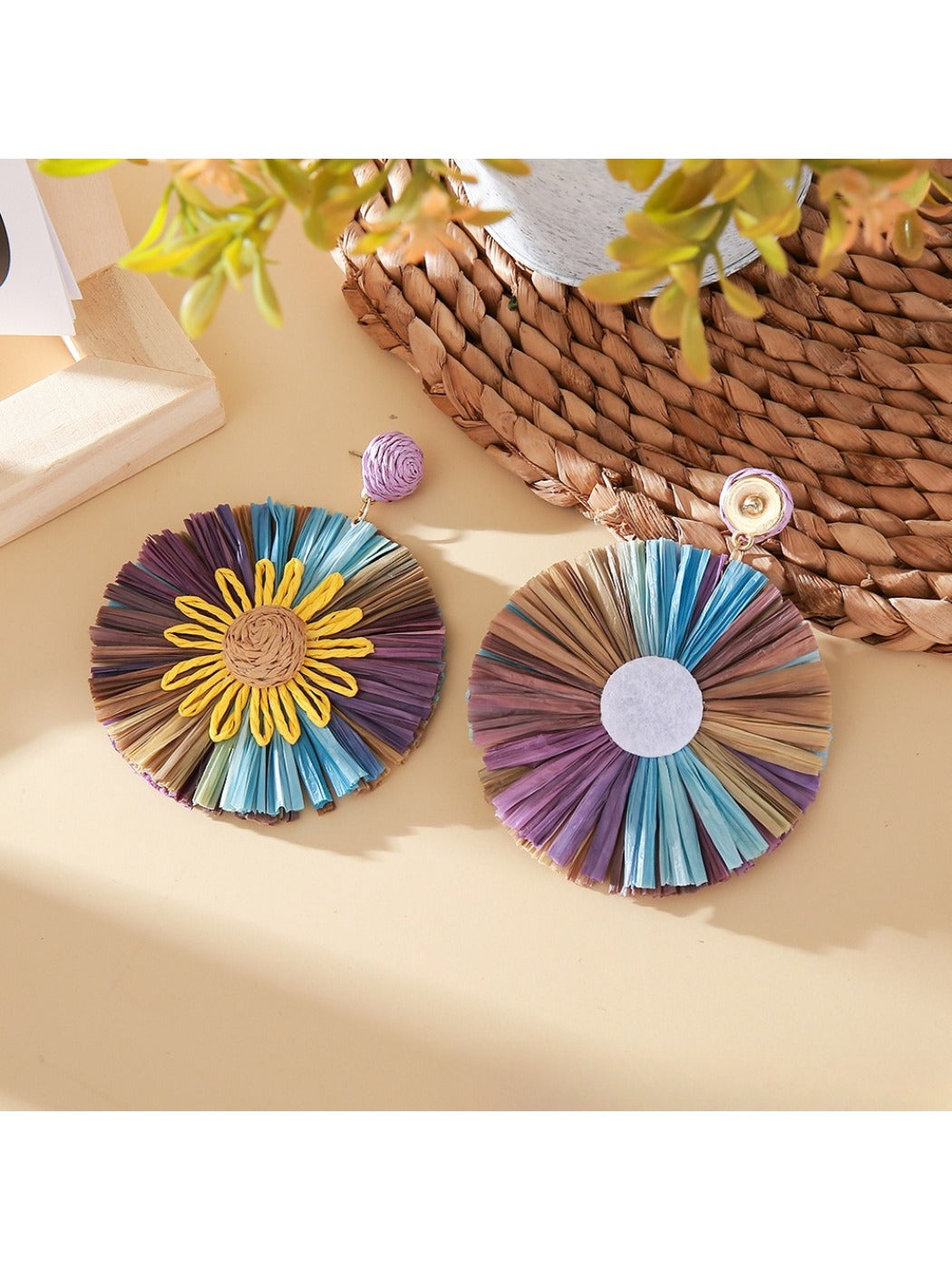 Pair of sunflower shaped earrings with yellow and brown color block design