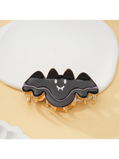 Close-up of Halloween bat hair clip showing textured wing design