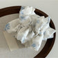 Gifty Sweet Lace Tiny Floral Scrunchie folded to display lace trim and floral design