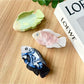 Close-up of Beau fish shaped hair claw clip showing smooth matte finish