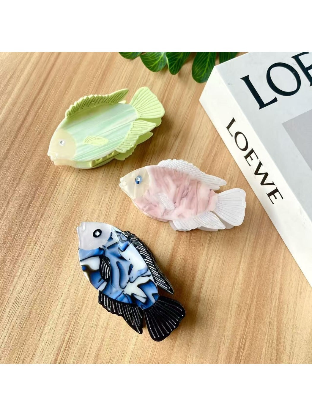 Close-up of Beau fish shaped hair claw clip showing smooth matte finish