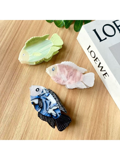 Close-up of Beau fish shaped hair claw clip showing smooth matte finish