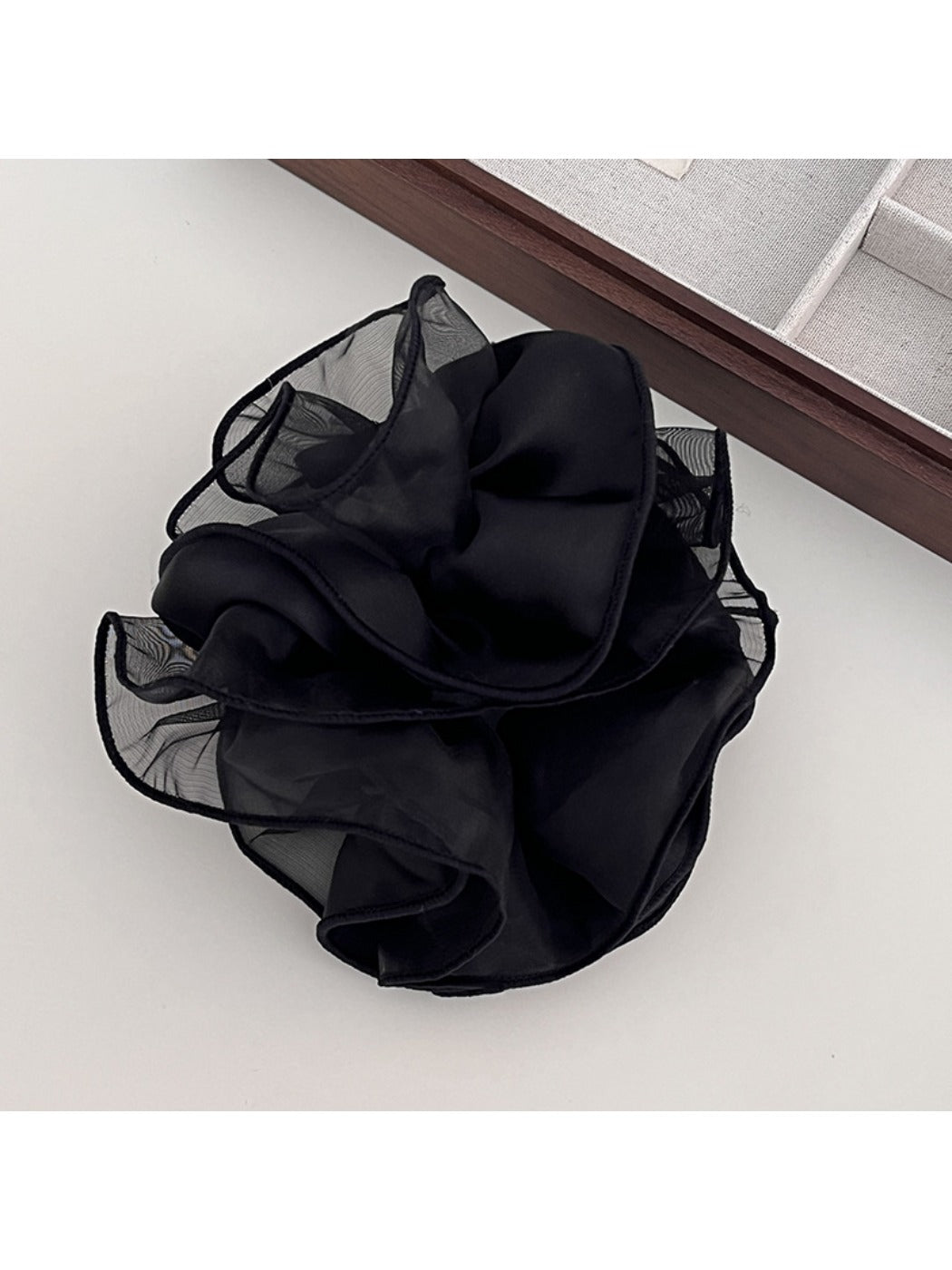 Side view of double layer satin ruched scrunchie in pastel color