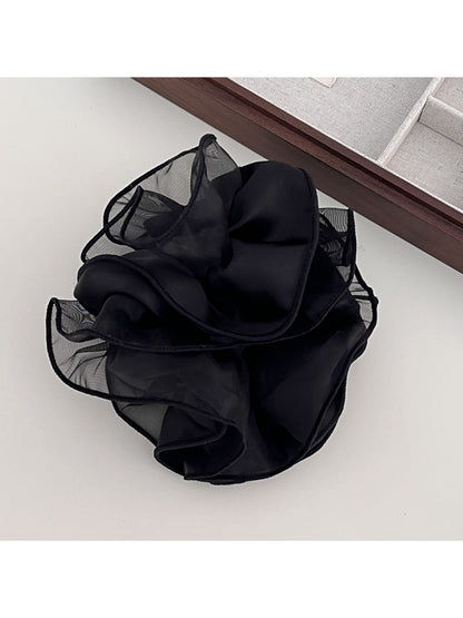Side view of double layer satin ruched scrunchie in pastel color