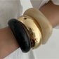 Close-up of Lovra polished round bracelet showing smooth, shiny surface