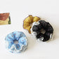 Gifty vintage scrunchie with white polka dots and ruffled fabric detail