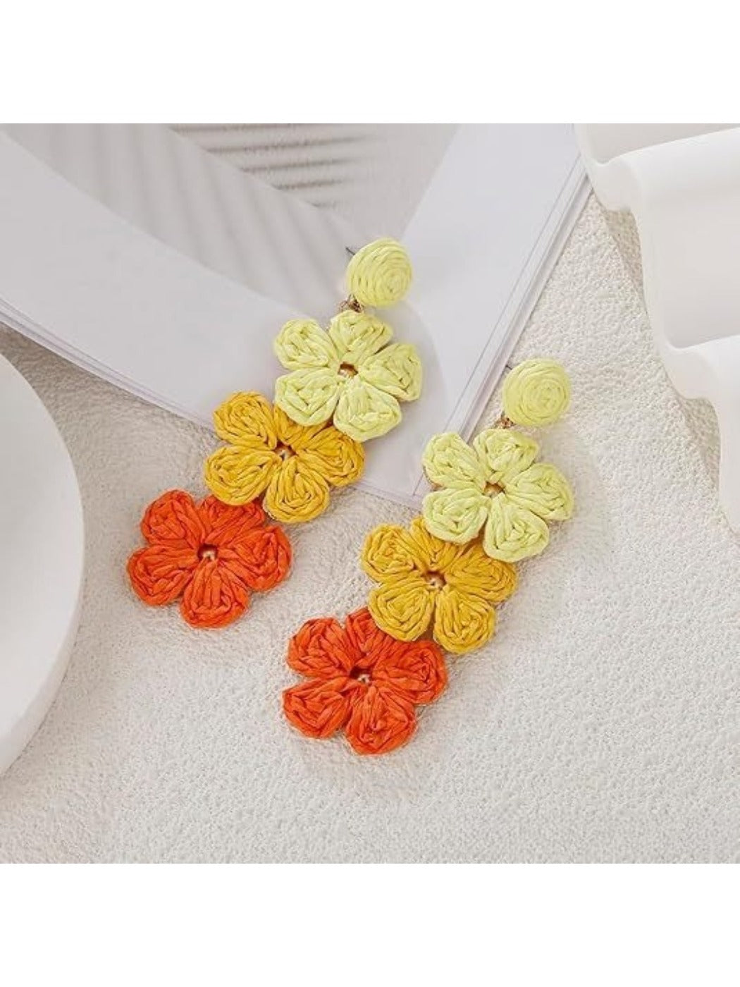 Earedge earrings laid flat showing detailed color block pattern and drop style