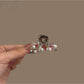Beau hair clip clipped into blonde hair highlighting its vibrant colors and shape