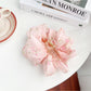 Top view of Beau floral print hair claw clip emphasizing shape and colors