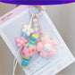 Handmade crochet candy shaped keychain in pastel colors with a metal keyring