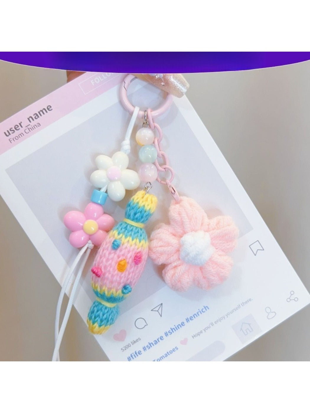 Handmade crochet candy shaped keychain in pastel colors with a metal keyring